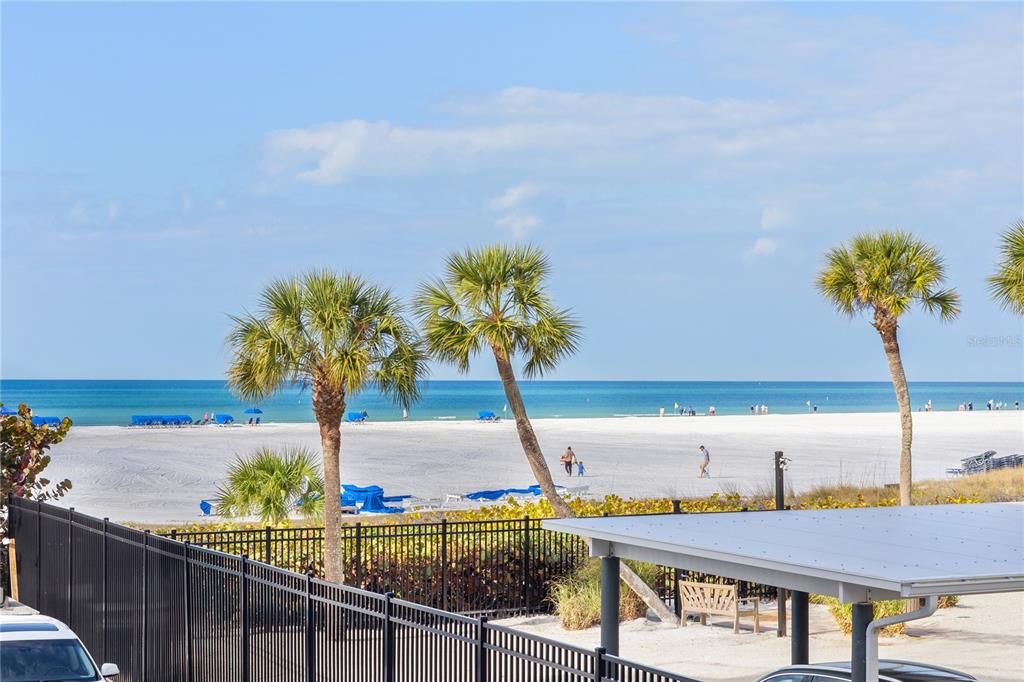 5830 Midnight Pass Road, Unit T22 Sarasota, FL 34242 - Photo 28 of 65 a view of a terrace with chairs