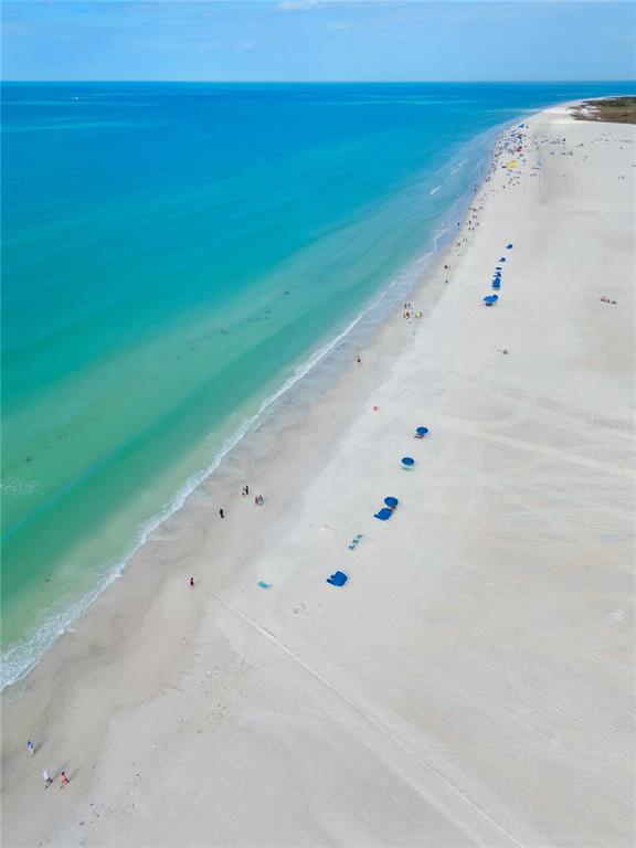 5830 Midnight Pass Road, Unit T22 Sarasota, FL 34242 - Photo 36 of 65 a view of an ocean beach