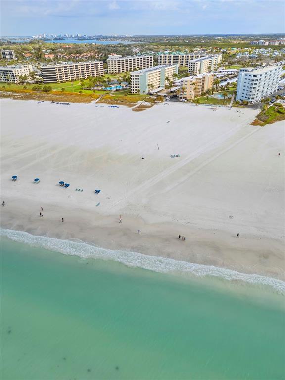 5830 Midnight Pass Road, Unit T22 Sarasota, FL 34242 - Photo 37 of 65 a view of an ocean and beach