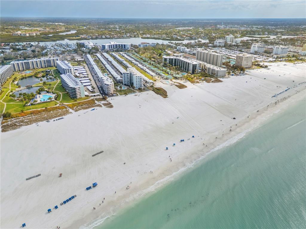5830 Midnight Pass Road, Unit T22 Sarasota, FL 34242 - Photo 43 of 65 an aerial view of residential building and ocean view