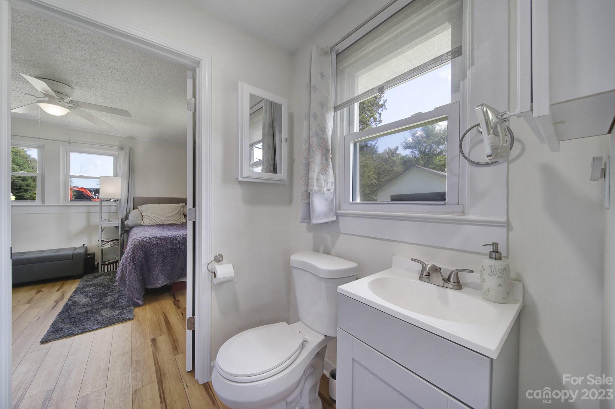 355 Walker Road Mount Pleasant, NC 28124 - Photo 13 of 33 a bathroom with a toilet a sink and a mirror