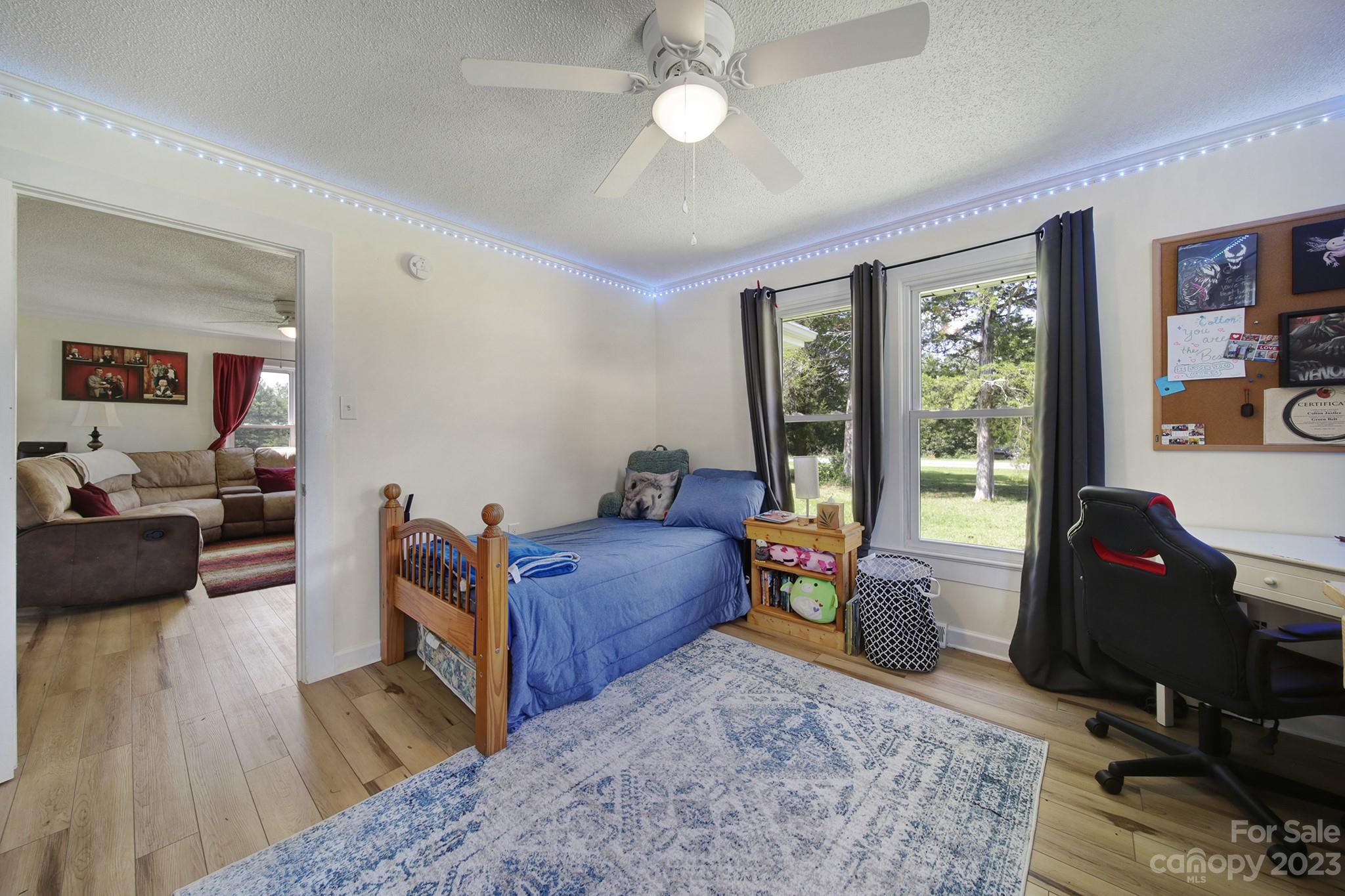 355 Walker Road Mount Pleasant, NC 28124 - Photo 15 of 33 a living room with furniture and a flat screen tv