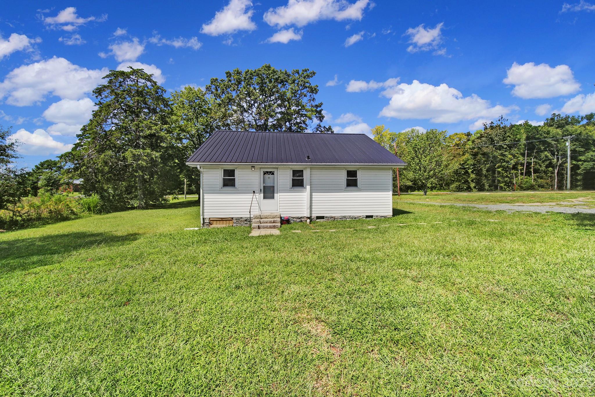 355 Walker Road Mount Pleasant, NC 28124 - Photo 18 of 33 a view of a house with a yard