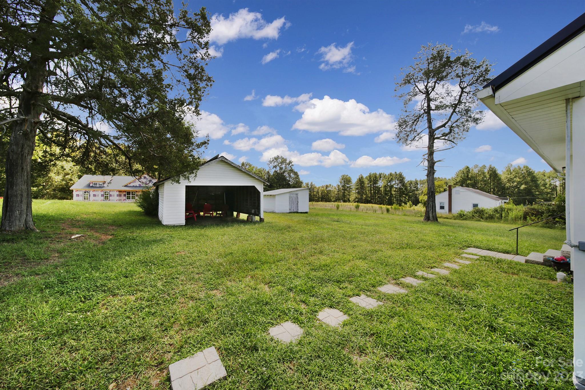 355 Walker Road Mount Pleasant, NC 28124 - Photo 20 of 33 a front view of a house with garden