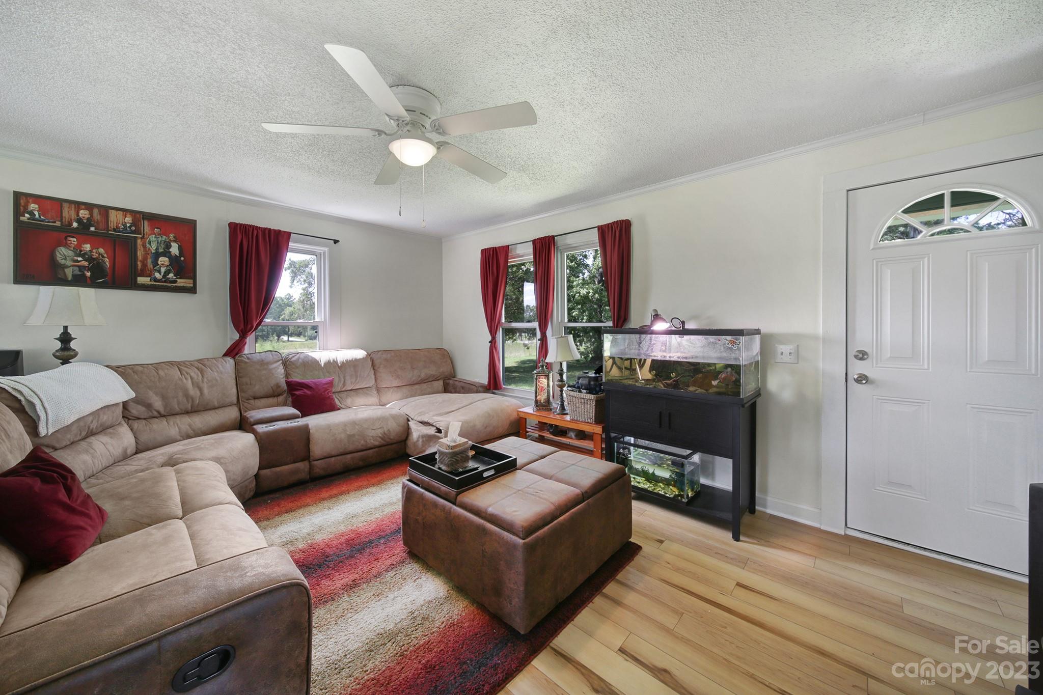 355 Walker Road Mount Pleasant, NC 28124 - Photo 2 of 33 a living room with furniture and a ceiling fan