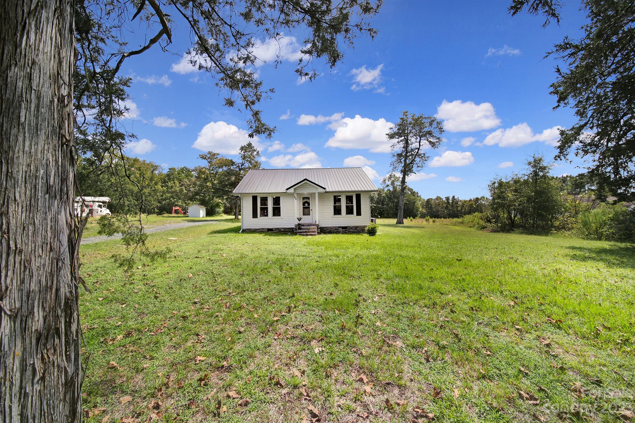 355 Walker Road Mount Pleasant, NC 28124 - Photo 30 of 33 a front view of a house with garden