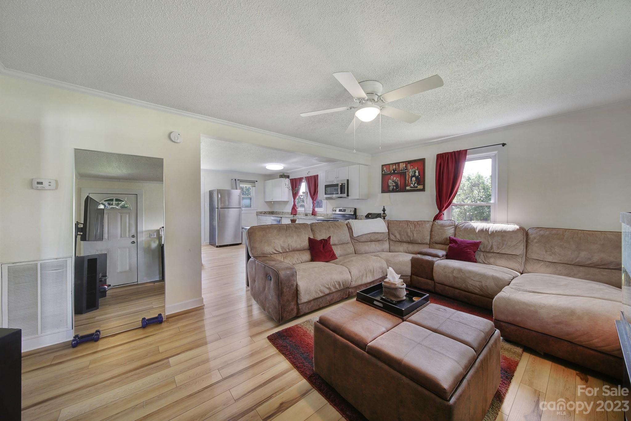 355 Walker Road Mount Pleasant, NC 28124 - Photo 4 of 33 a living room with furniture and wooden floor