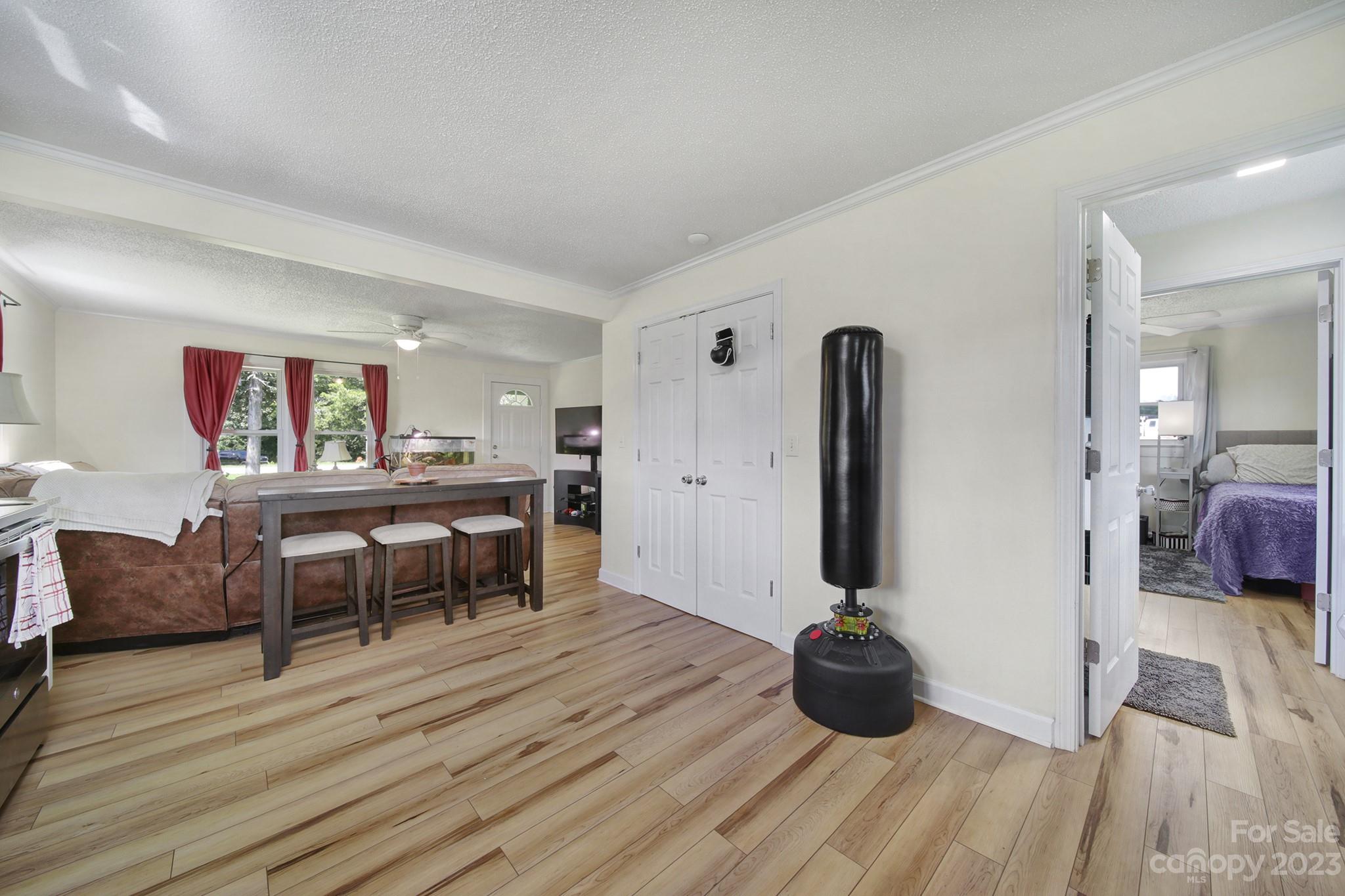 355 Walker Road Mount Pleasant, NC 28124 - Photo 9 of 33 a view of a livingroom with furniture and wooden floor
