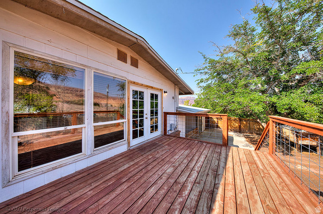 615 East Rose Tree Lane Moab, UT 84532 - Photo 30 of 40 Wooden deck with french doors.