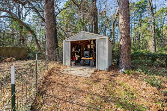 a view of a car park in front of house