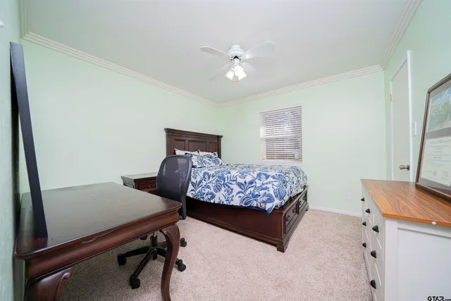 a bedroom with a bed and a table in it