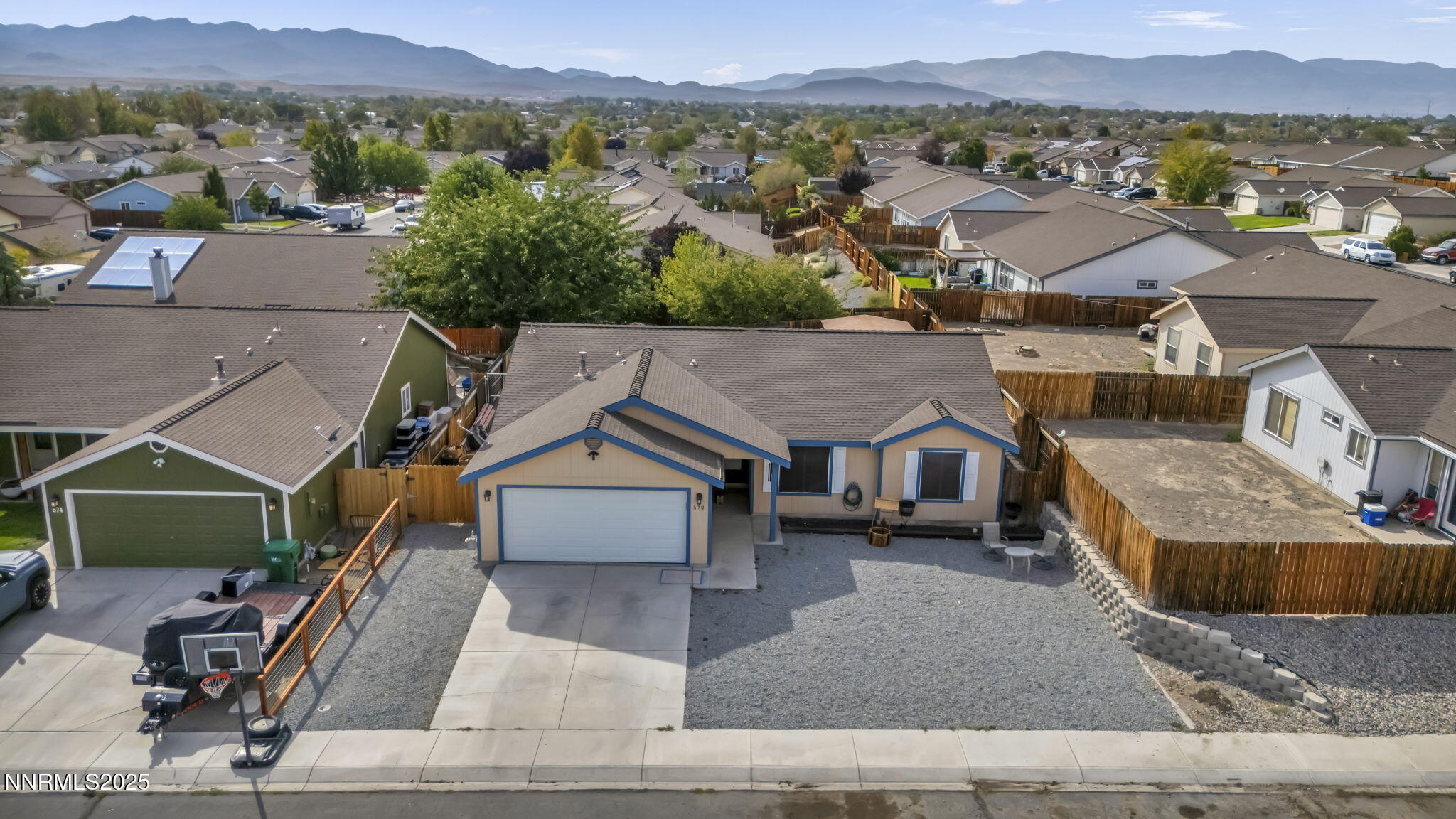 an aerial view of residential houses and outdoor space