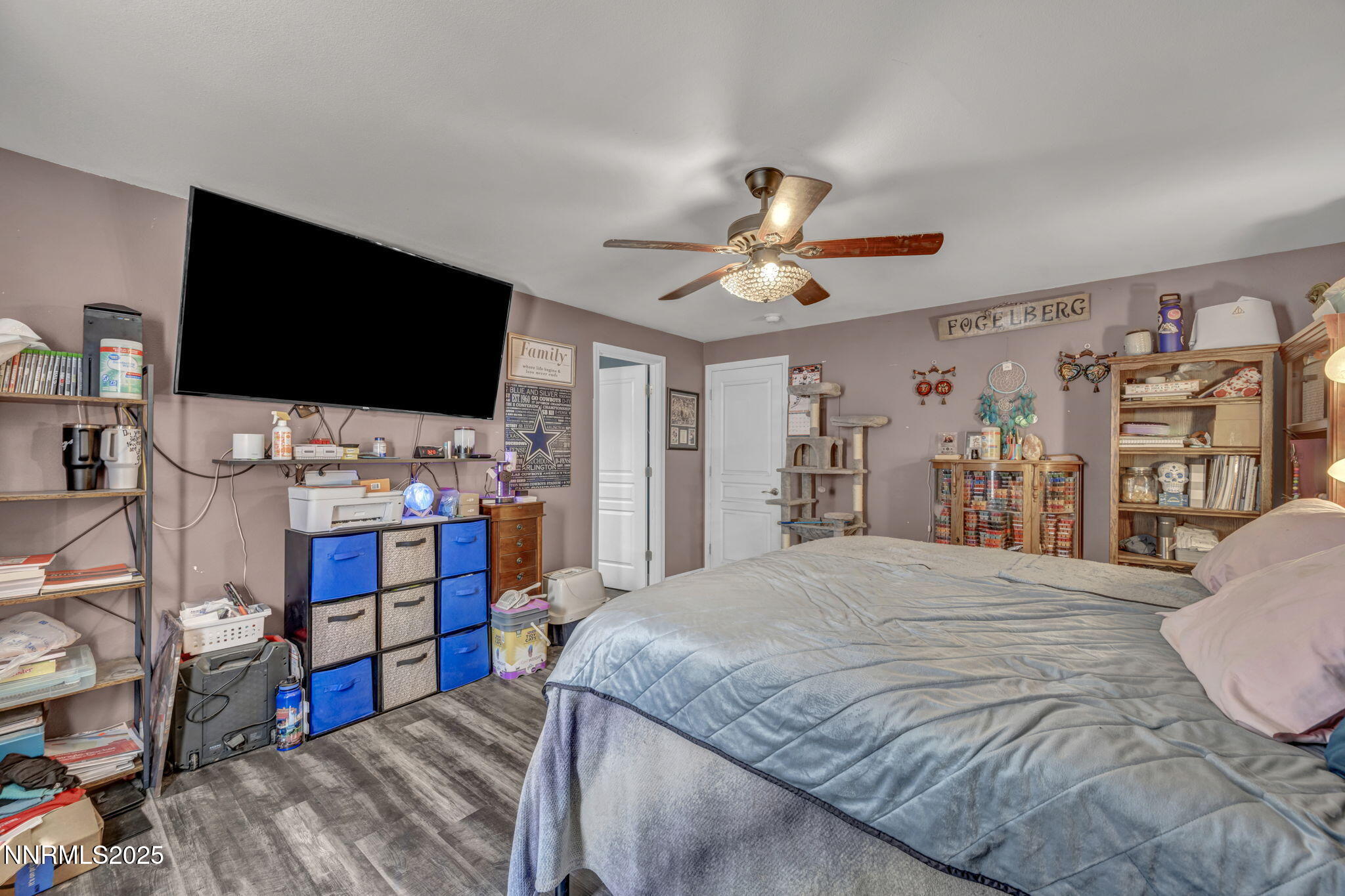572 Spur Way Fernley, NV 89408 - Photo 23 of 48 a bedroom with a bed furniture and a flat screen tv