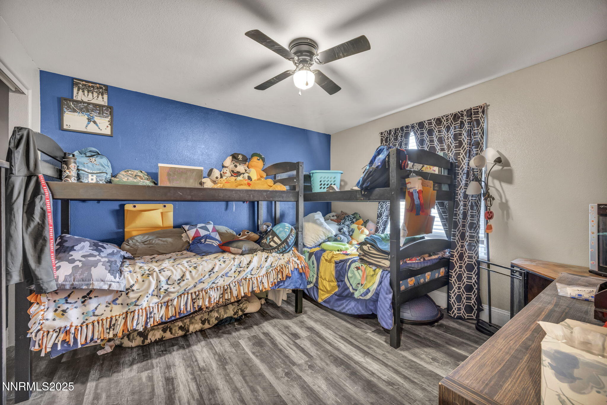 572 Spur Way Fernley, NV 89408 - Photo 24 of 48 a bedroom with bed and a chandelier