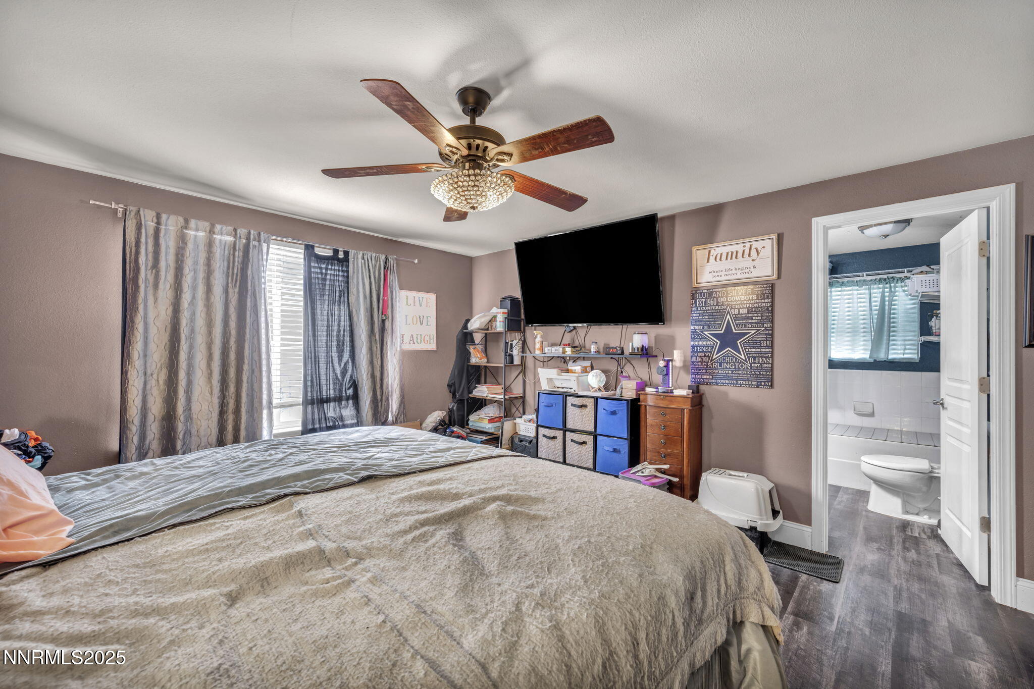 572 Spur Way Fernley, NV 89408 - Photo 25 of 48 a bedroom with a bed and a flat screen tv