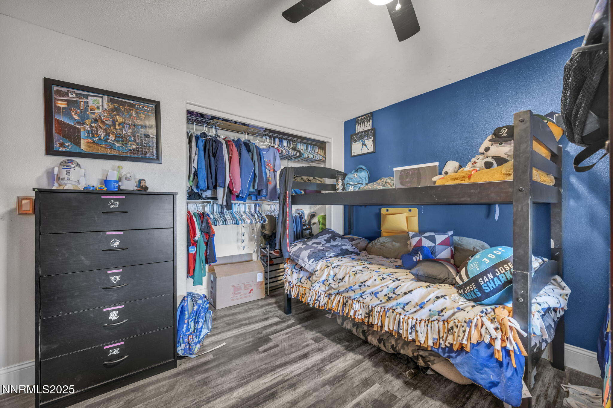 572 Spur Way Fernley, NV 89408 - Photo 26 of 48 a bedroom with bed and a chandelier