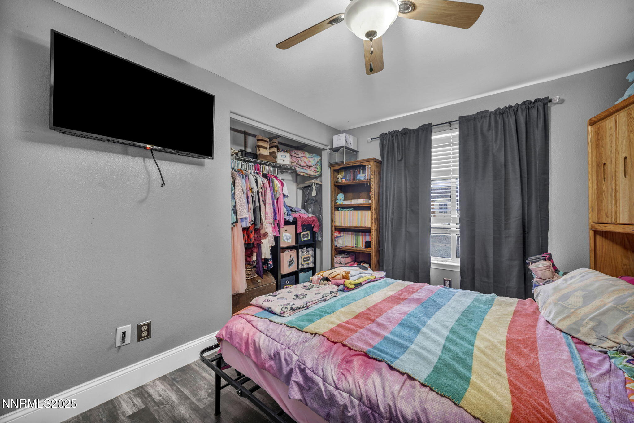 572 Spur Way Fernley, NV 89408 - Photo 30 of 48 a bedroom with a bed and a flat screen tv