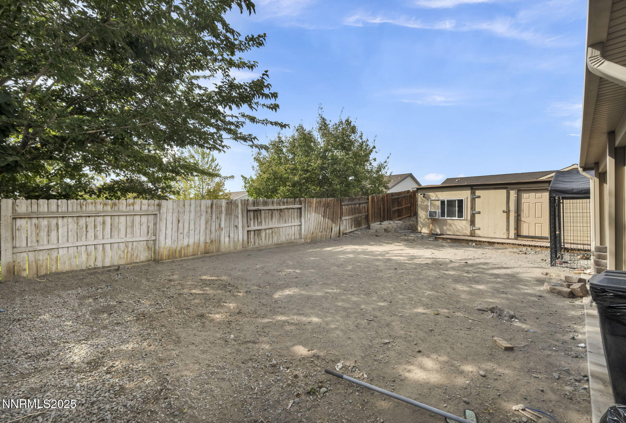 572 Spur Way Fernley, NV 89408 - Photo 34 of 48 a view of a house with a yard and wooden fence