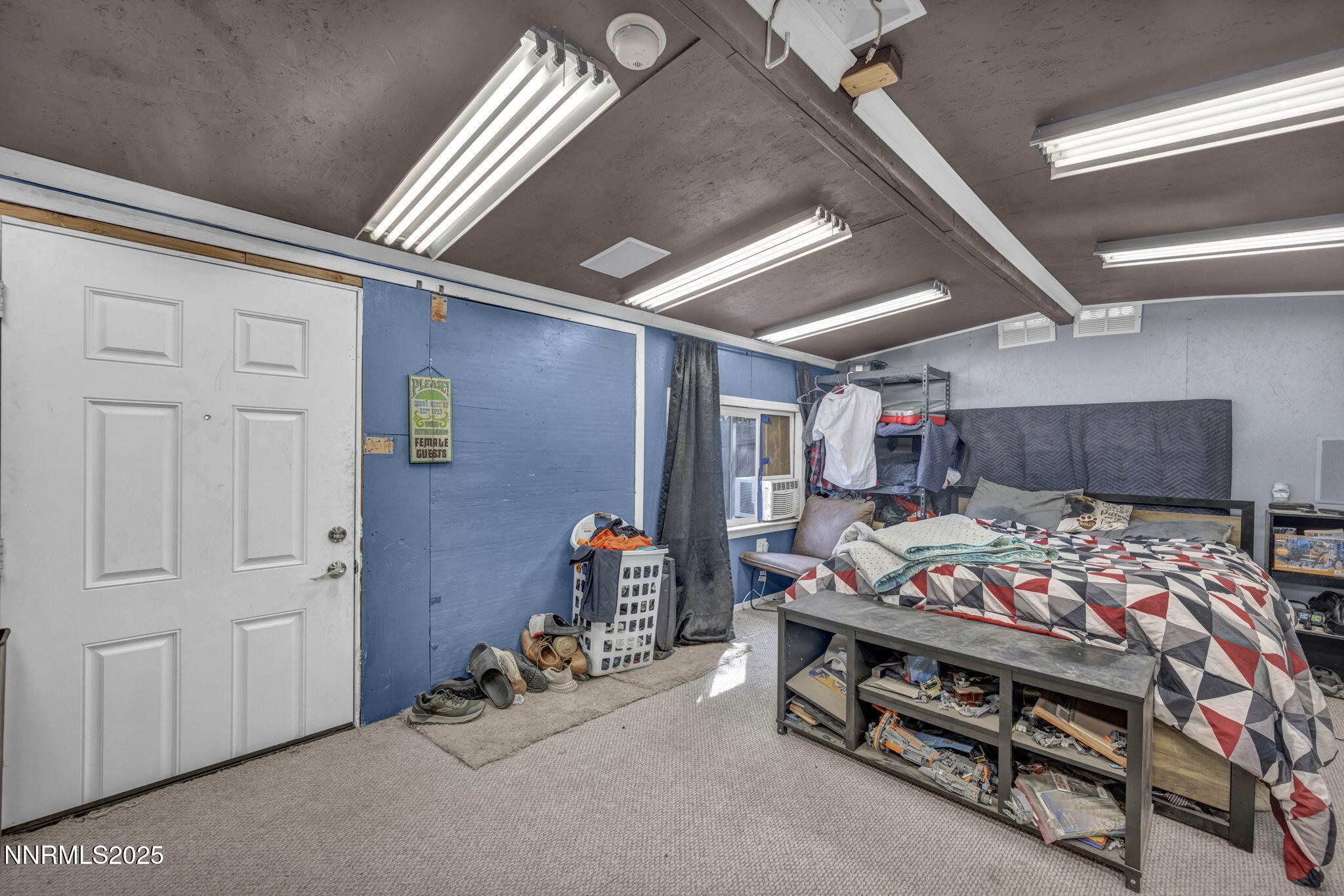 572 Spur Way Fernley, NV 89408 - Photo 36 of 48 a bedroom with bed and a chandelier