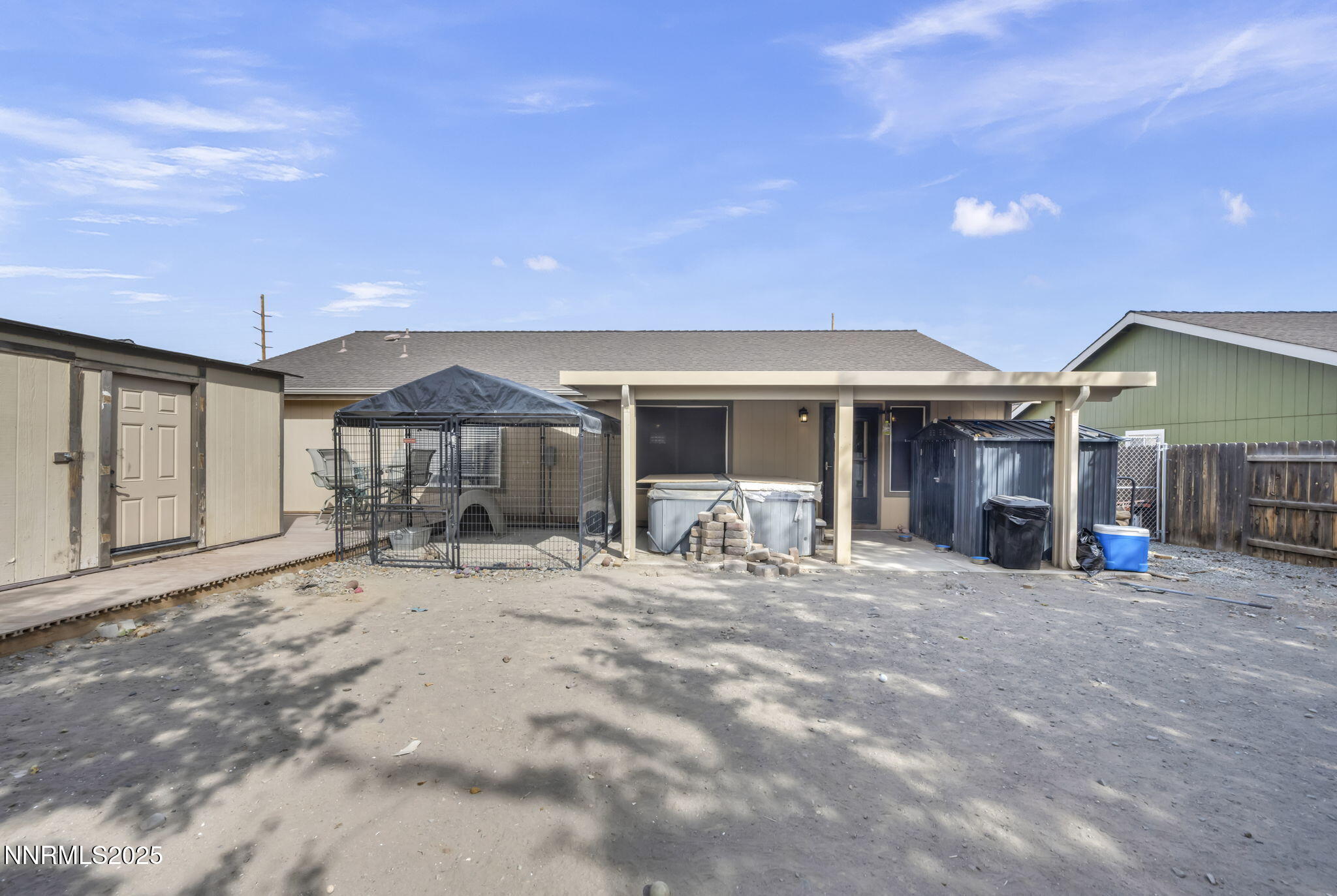 572 Spur Way Fernley, NV 89408 - Photo 39 of 48 a view of a house with backyard sitting area and porch