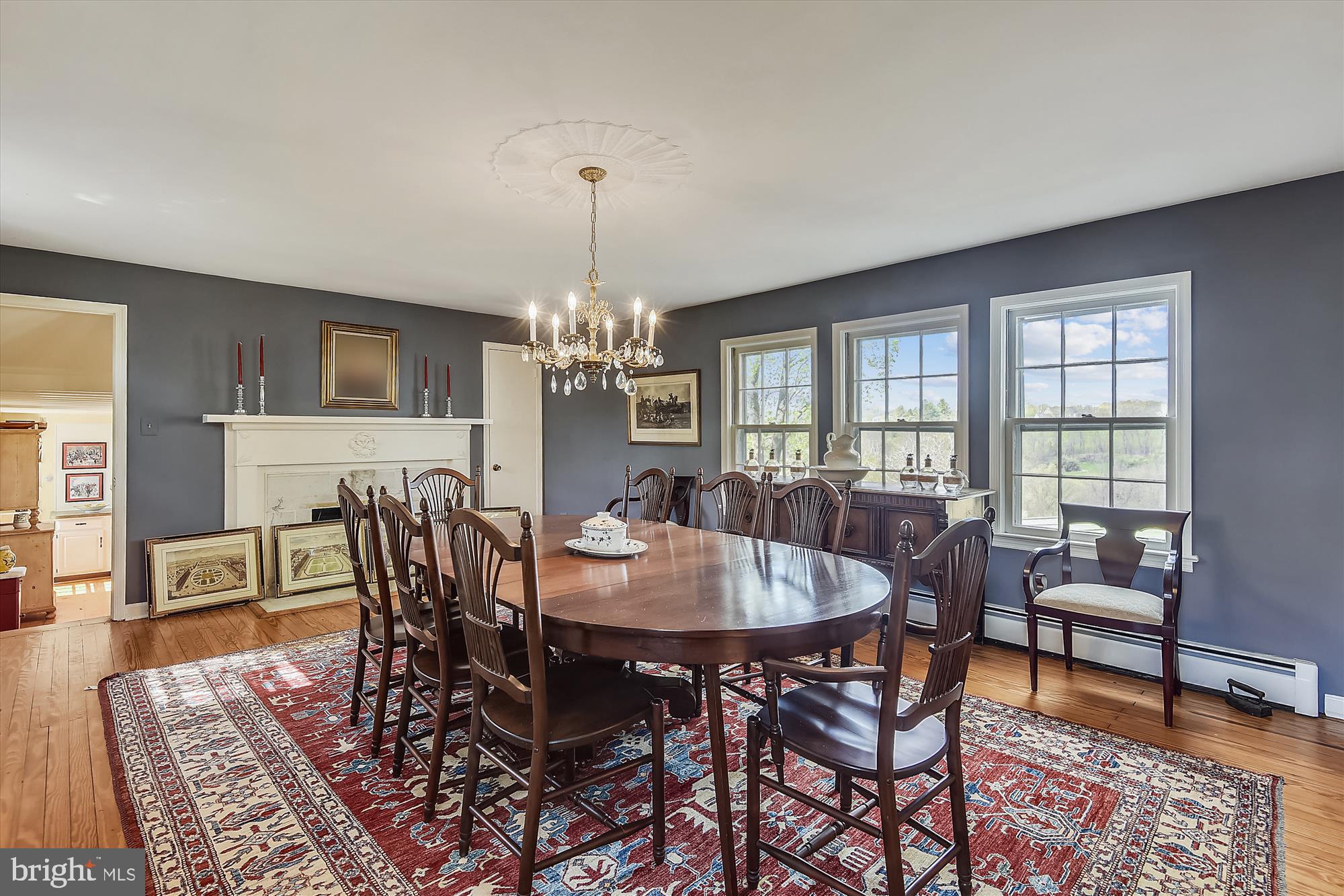 20209 St Louis Road Purcellville, VA 20132 - Photo 18 of 62 a view of a dining room with furniture a chandelier and wooden floor