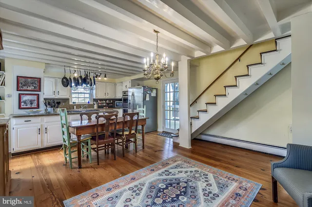 a kitchen with stainless steel appliances granite countertop a refrigerator and a stove