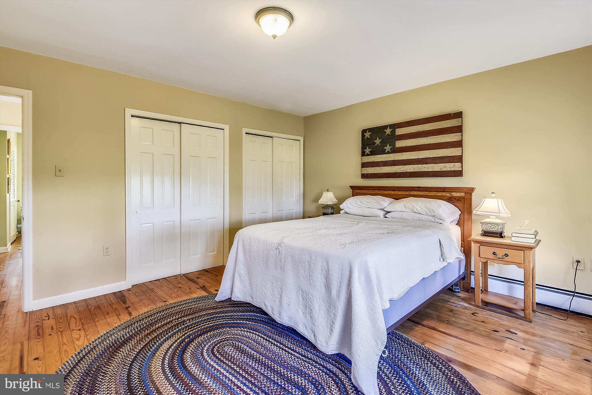 20209 St Louis Road Purcellville, VA 20132 - Photo 25 of 62 a bedroom with a bed and wooden floor
