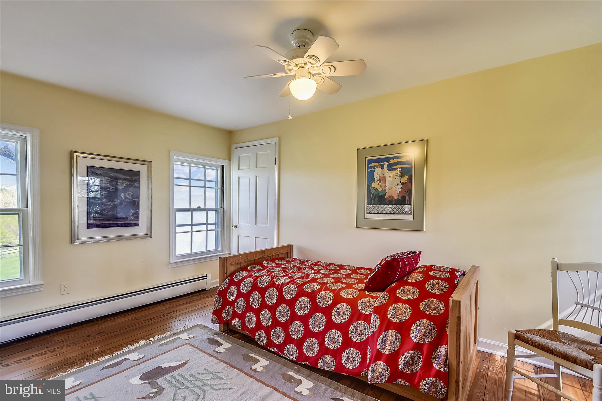 20209 St Louis Road Purcellville, VA 20132 - Photo 32 of 62 a bedroom with a bed and wooden floor