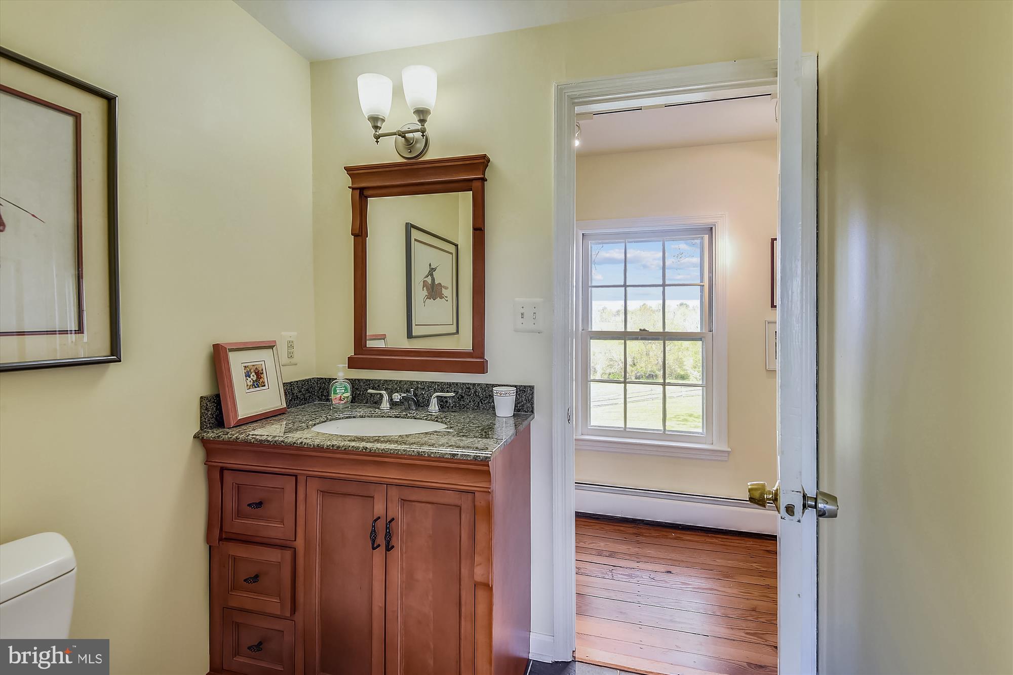20209 St Louis Road Purcellville, VA 20132 - Photo 40 of 62 a bathroom with a granite countertop sink toilet and mirror