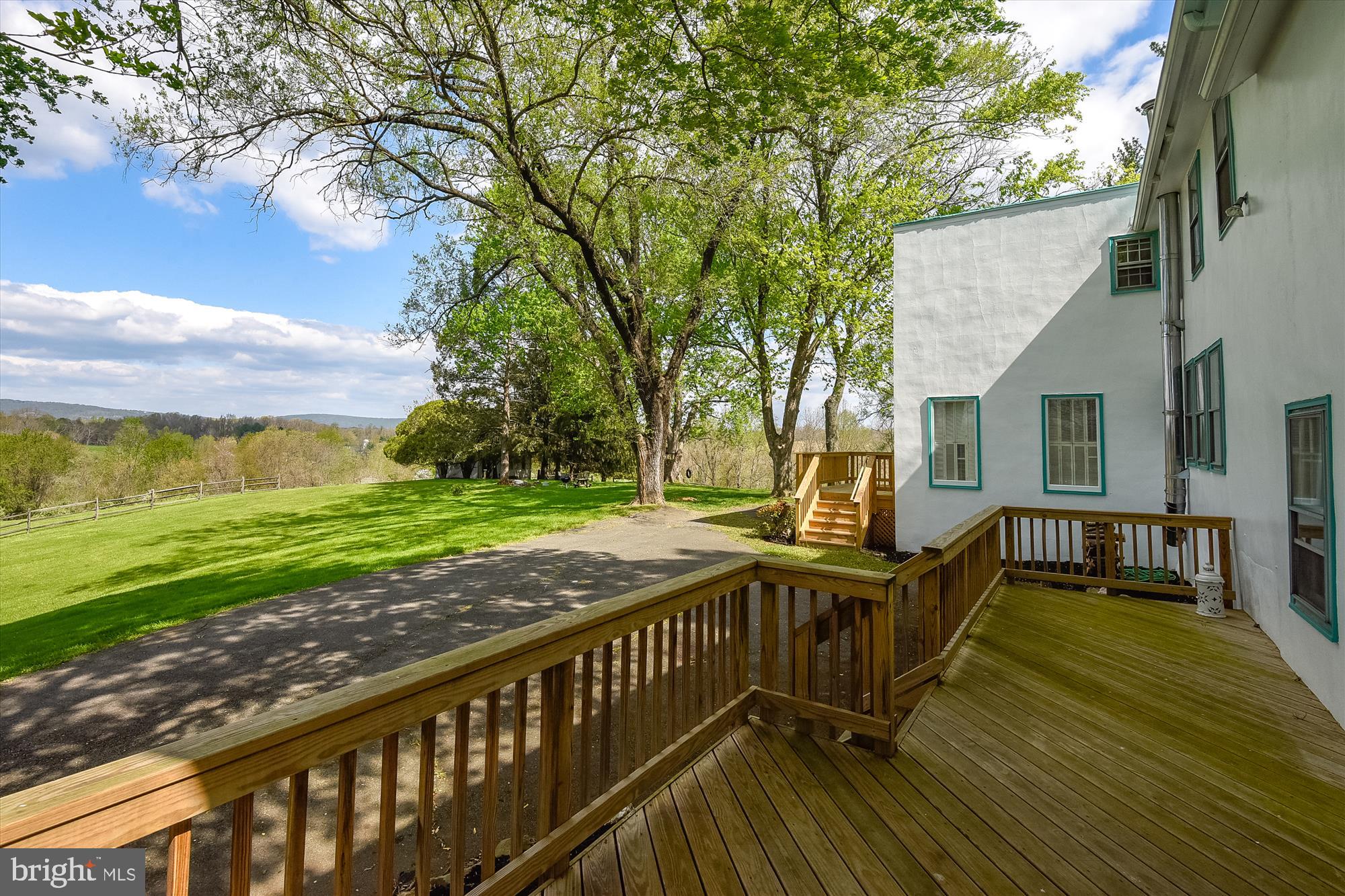 20209 St Louis Road Purcellville, VA 20132 - Photo 52 of 62 a view of a deck with chairs and a yard with wooden floor