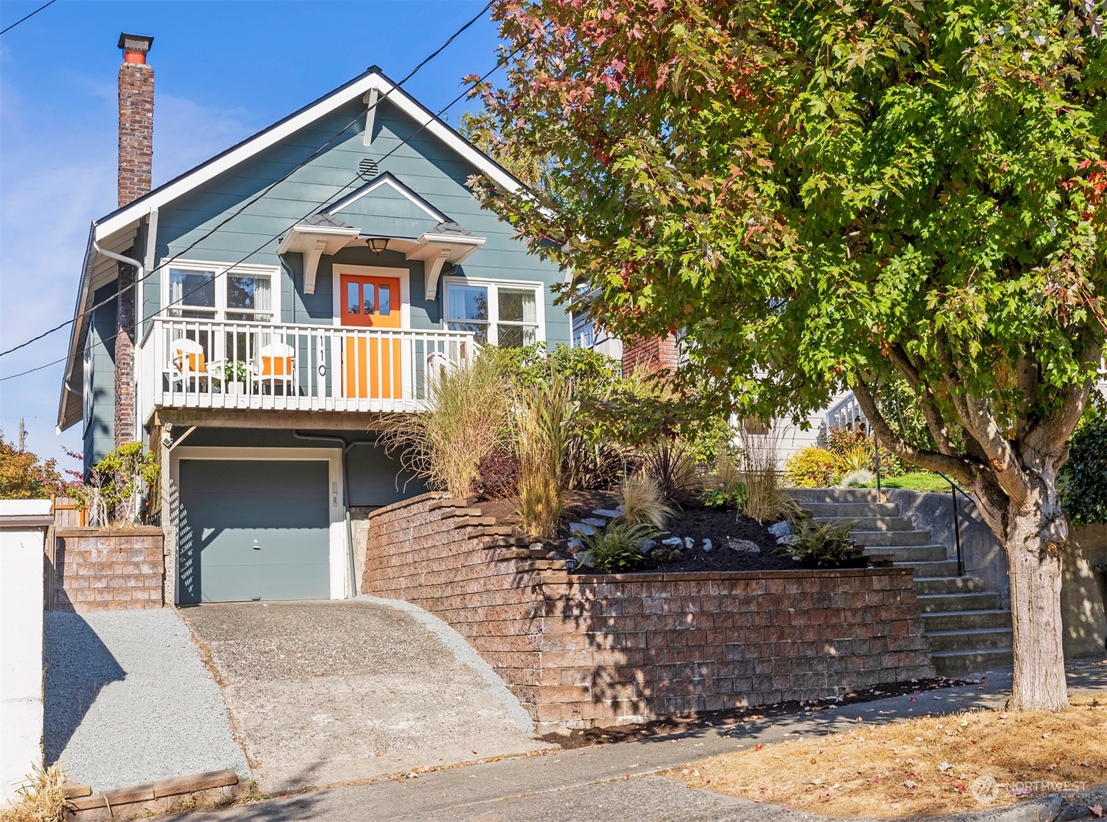 110 North 76th Street Seattle, WA 98103 - Photo 1 of 36 a front view of a house with a yard and garage