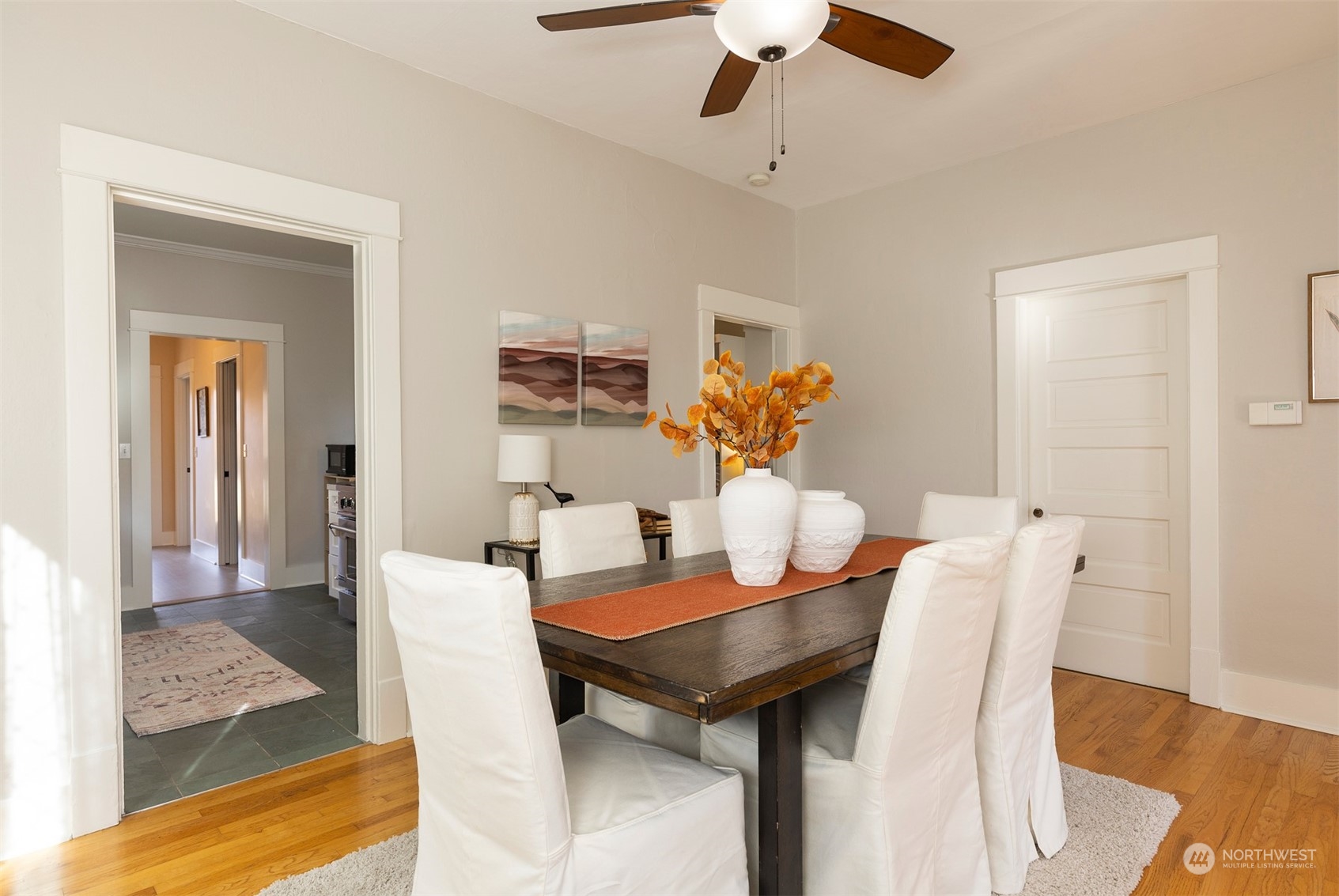 110 North 76th Street Seattle, WA 98103 - Photo 11 of 36 a view of a dining room with furniture and wooden floor