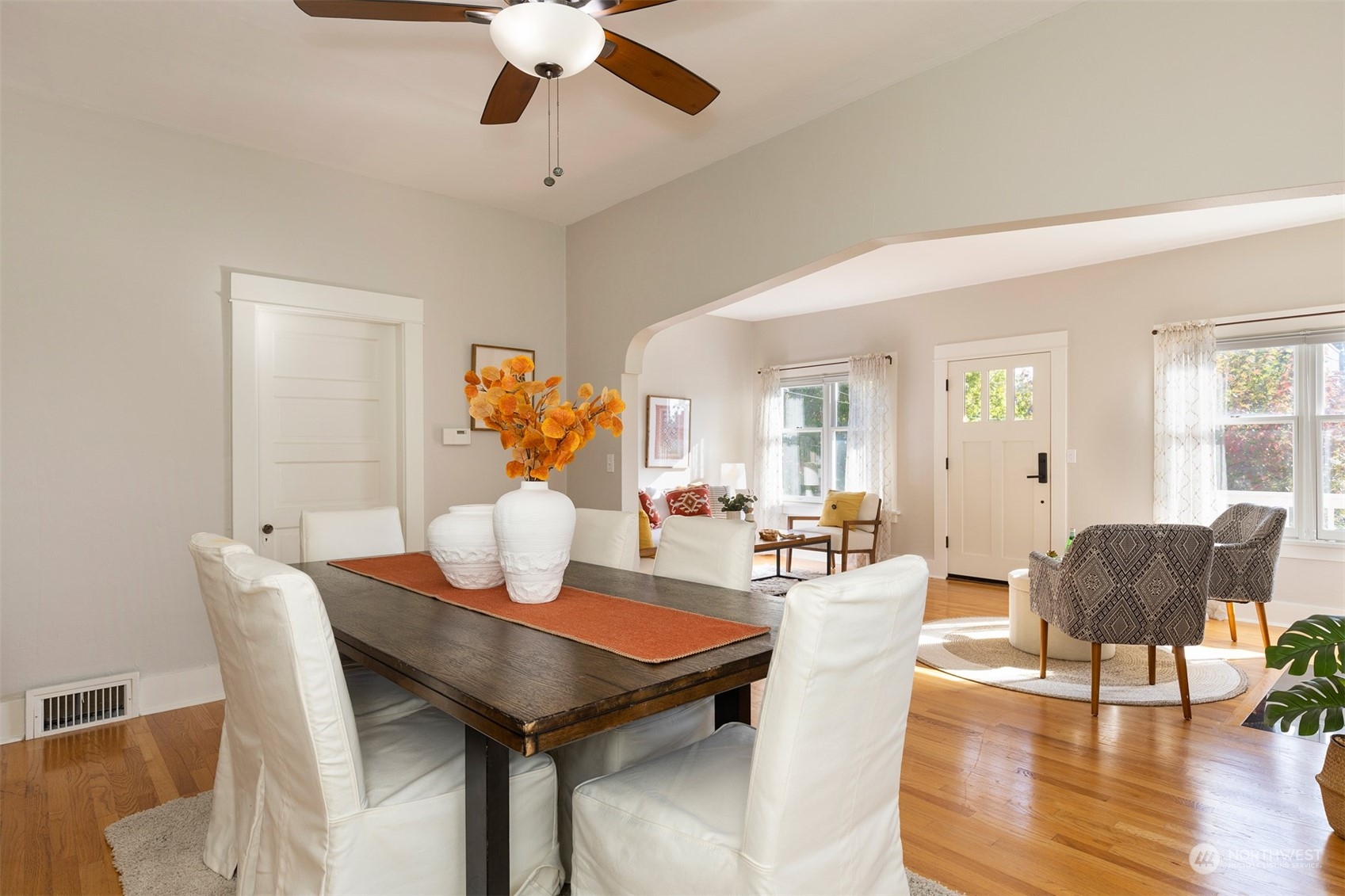 110 North 76th Street Seattle, WA 98103 - Photo 12 of 36 a view of a dining room with furniture and wooden floor