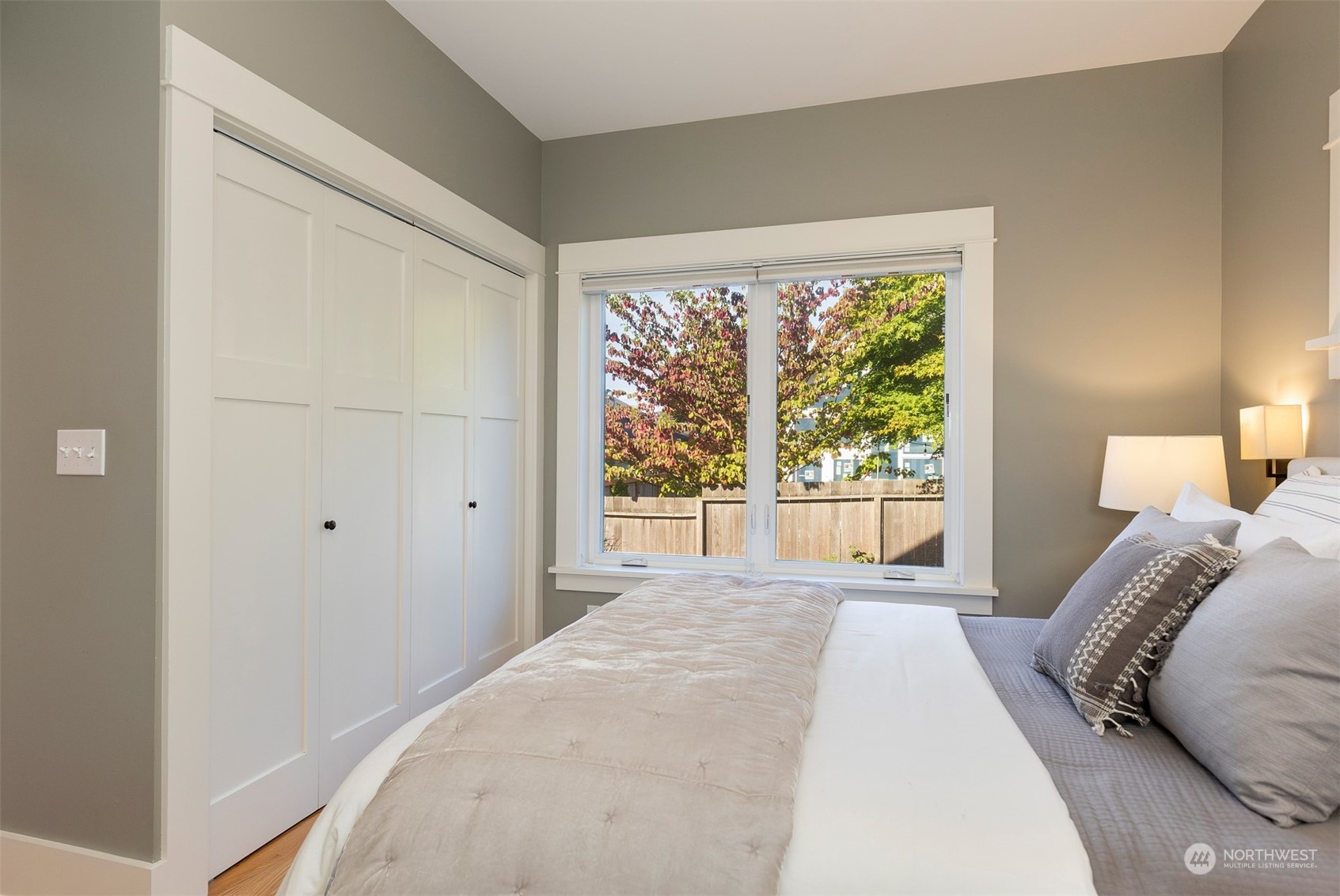 110 North 76th Street Seattle, WA 98103 - Photo 17 of 36 a bedroom with a bed and a large window