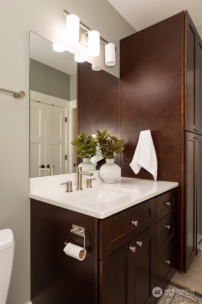 110 North 76th Street Seattle, WA 98103 - Photo 20 of 36 a bathroom with a sink vanity and a mirror