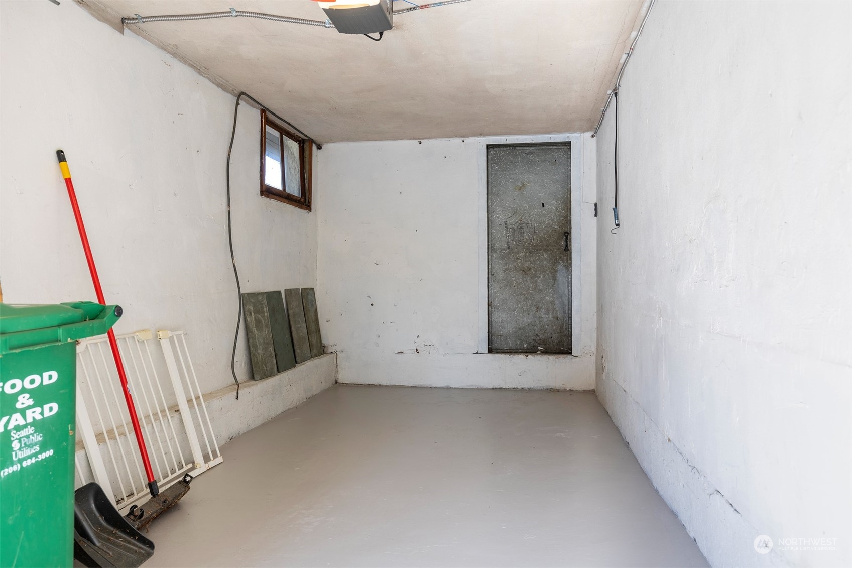 110 North 76th Street Seattle, WA 98103 - Photo 33 of 36 a view of an empty room with a window