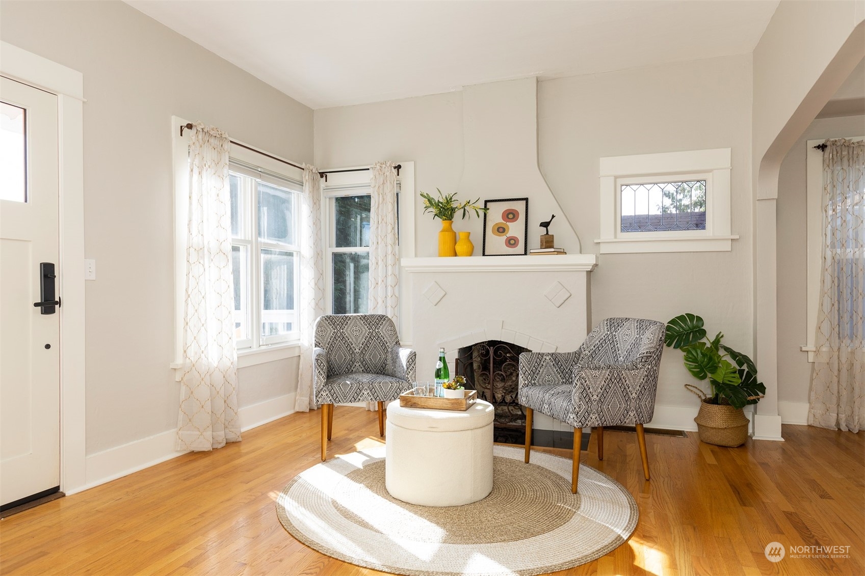 110 North 76th Street Seattle, WA 98103 - Photo 9 of 36 a living room with furniture and a fireplace