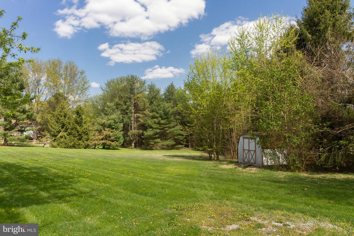 17615 Grace Road Hampstead, MD 21074 - Photo 11 of 30 a backyard of a house with lots of green space