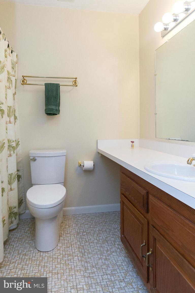 17615 Grace Road Hampstead, MD 21074 - Photo 18 of 30 a bathroom with a toilet sink and mirror