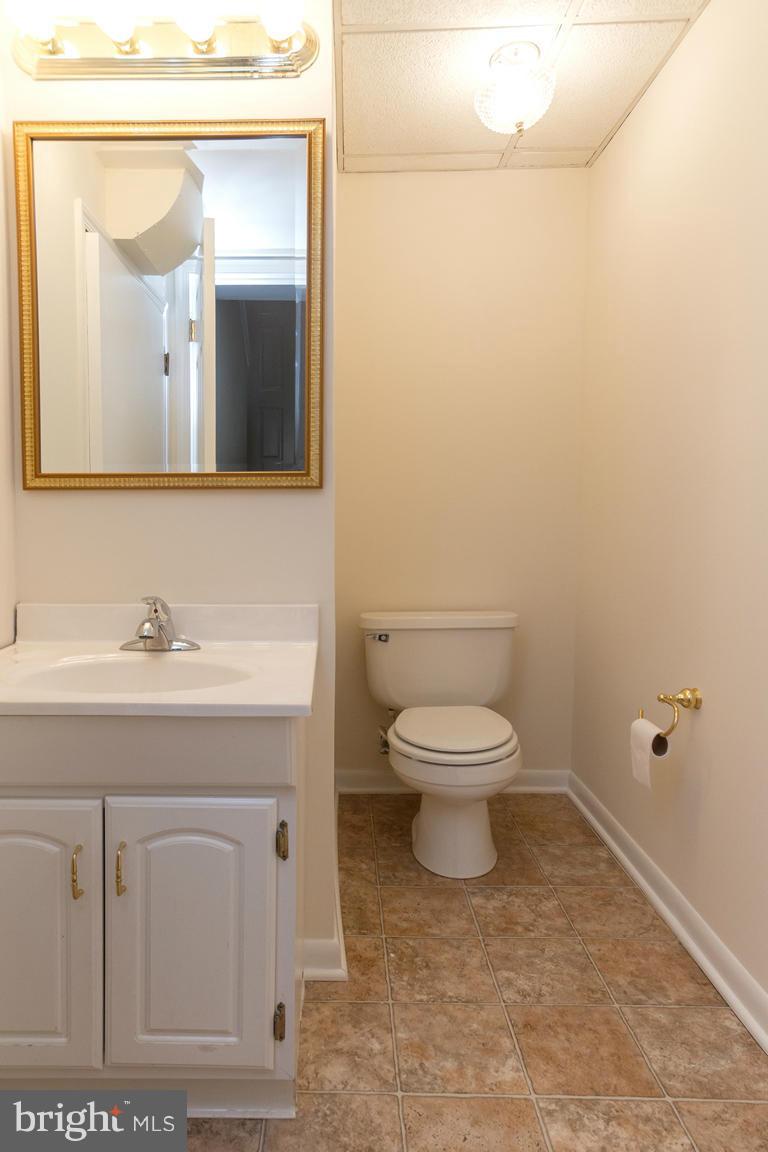17615 Grace Road Hampstead, MD 21074 - Photo 25 of 30 a bathroom with a toilet a sink and mirror
