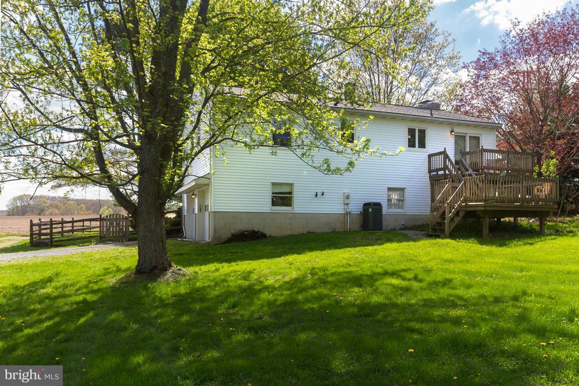 17615 Grace Road Hampstead, MD 21074 - Photo 26 of 30 a view of a house with backyard and a tree