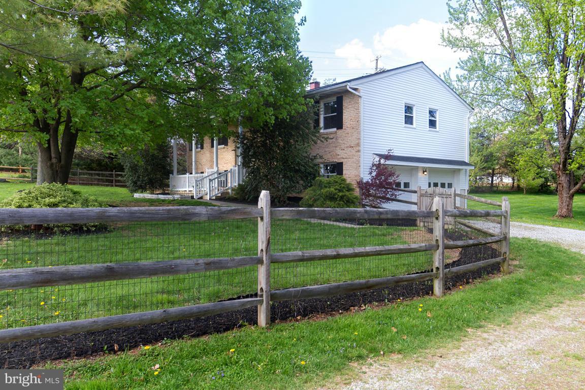 17615 Grace Road Hampstead, MD 21074 - Photo 29 of 30 a front view of a house with a yard table and chairs