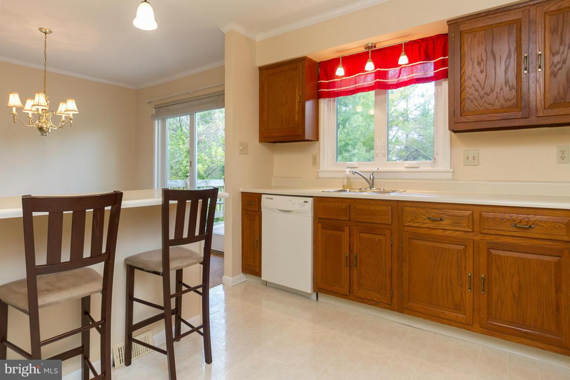 17615 Grace Road Hampstead, MD 21074 - Photo 6 of 30 a kitchen with a dining table chairs and window