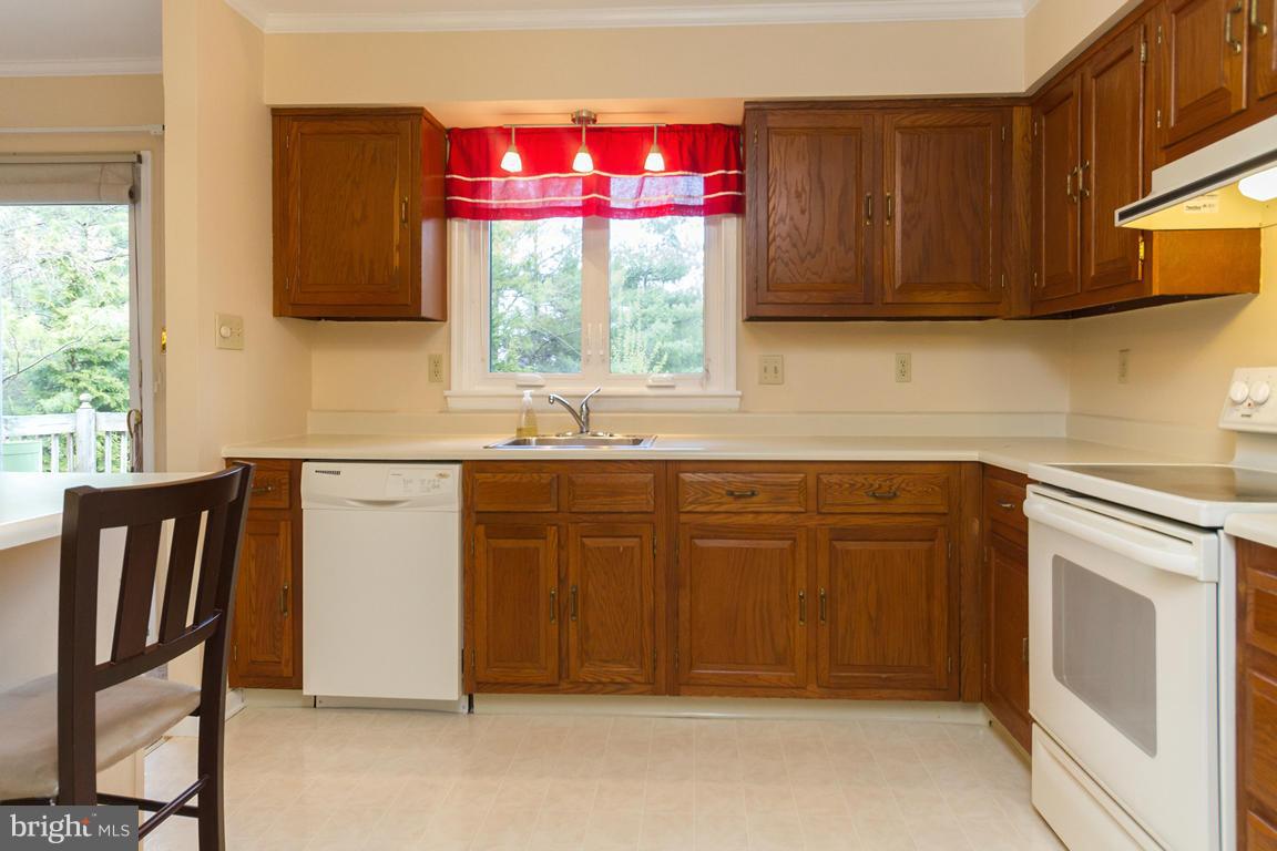 17615 Grace Road Hampstead, MD 21074 - Photo 7 of 30 a kitchen with a sink cabinets and window