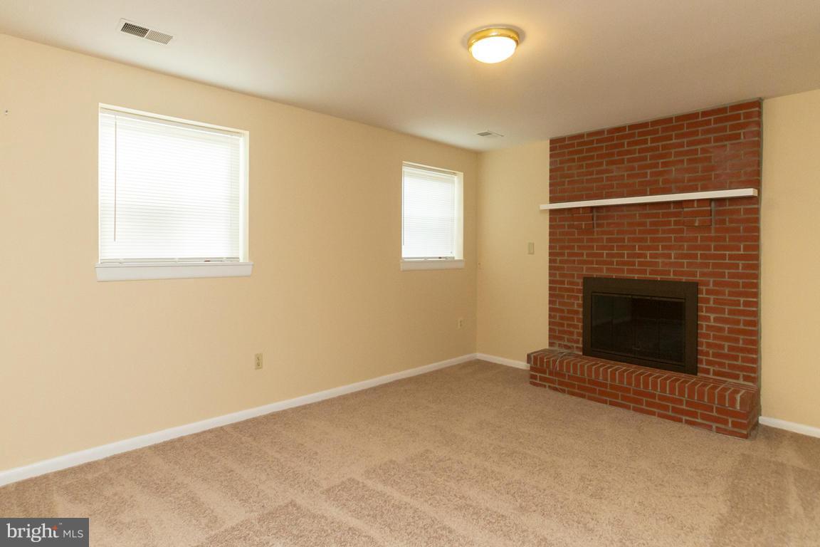 17615 Grace Road Hampstead, MD 21074 - Photo 9 of 30 a view of an empty room with a fireplace
