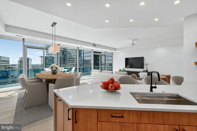 a kitchen with a stove and a white cabinets
