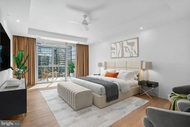 a bedroom with a large bed and a couch