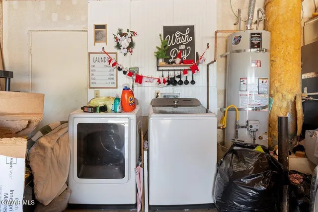 a utility room with multiple dryer and washer