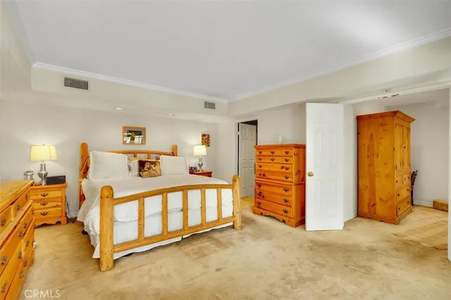 a view of a livingroom with furniture and staircase