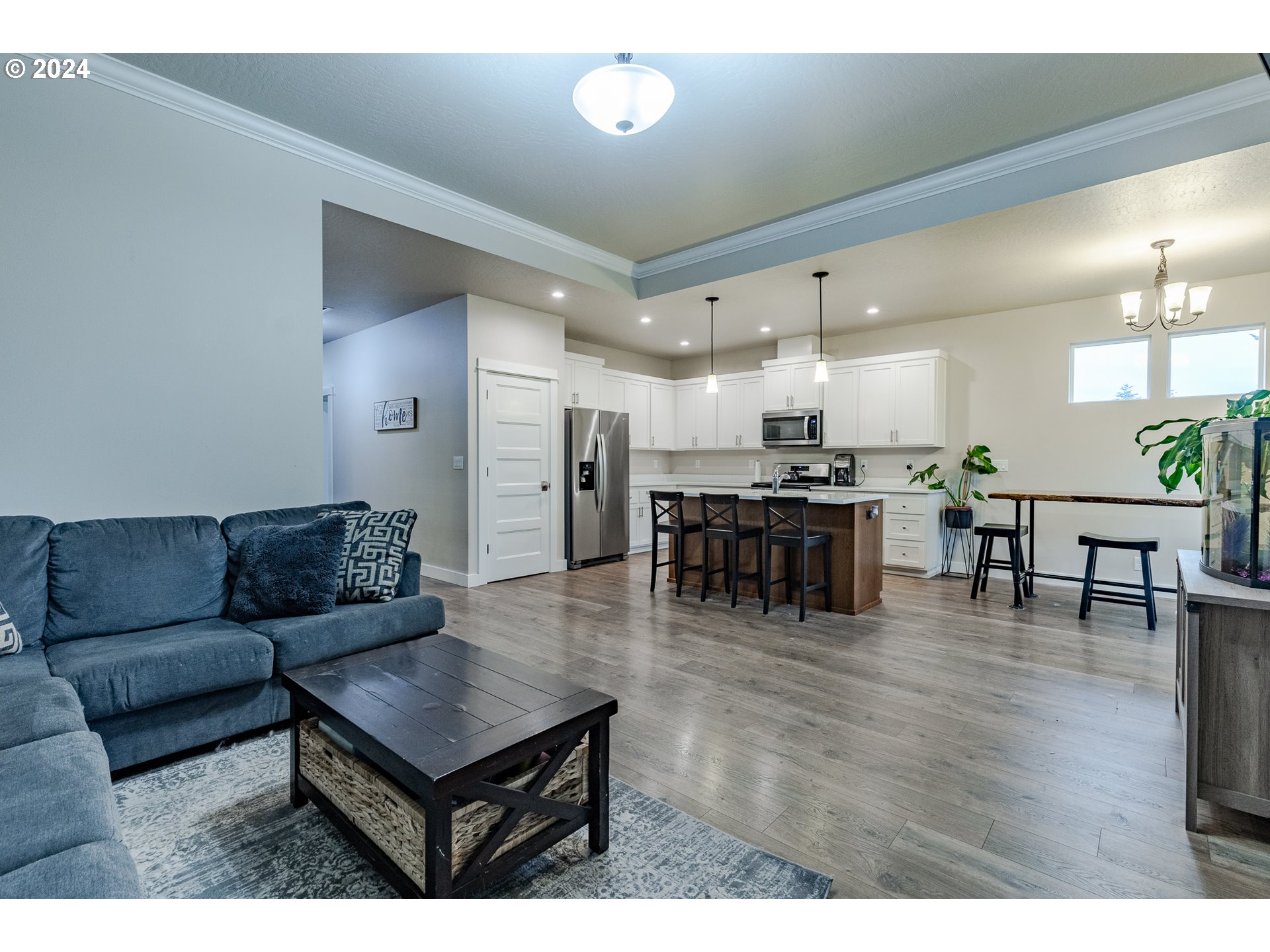 1026 West Olympic Street Springfield, OR 97477 - Photo 17 of 31 a living room with furniture and kitchen view